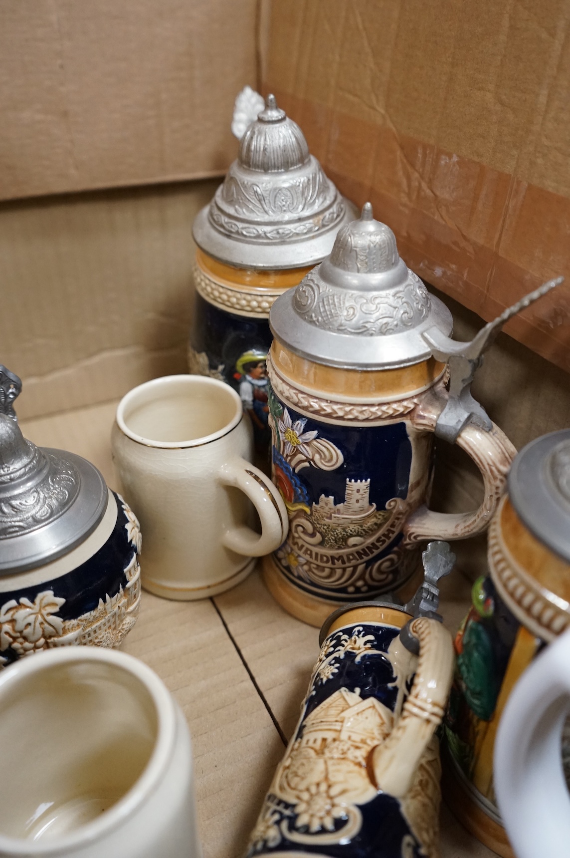 A collection of German ale steins and an Imari seated cat-37cm high